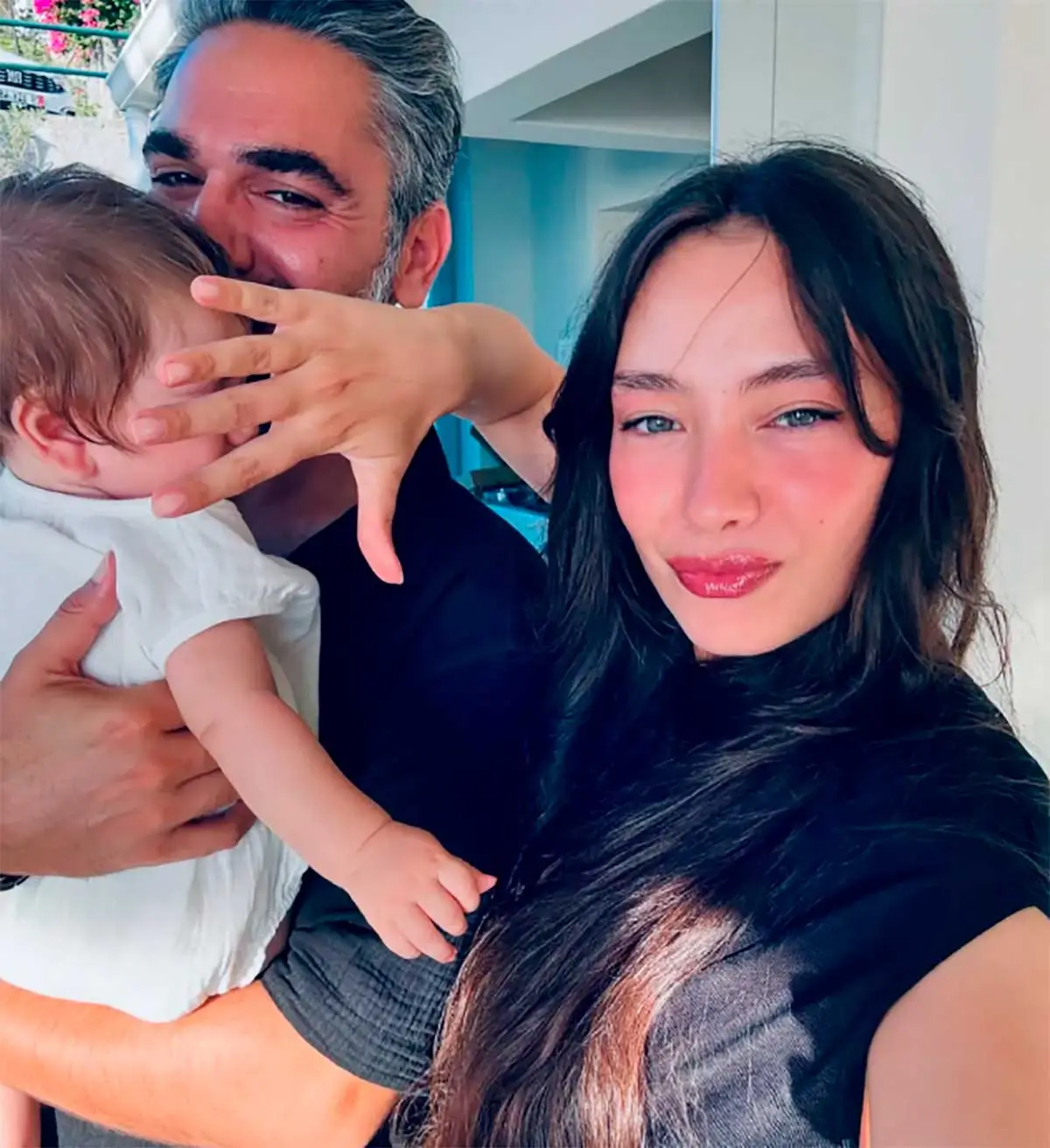 Neslihan Atagül smiling with her baby Aziz