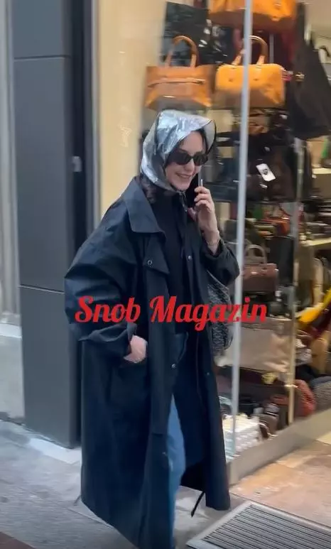 Plastic raincoat worn by Hande Ataizi