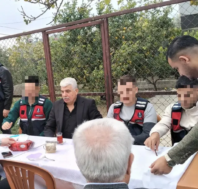 Abdullah Uçmak surrounded by gendarmerie officers