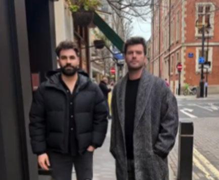 Kıvanç Tatlıtuğ taking a photo with a fan in London